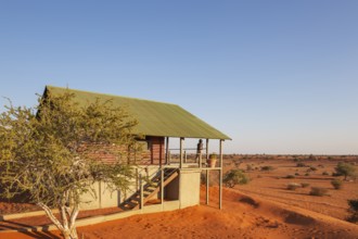 Some of the chalets of the Bagatelle Kalahari Game Ranch are built on top of a sand dune. Kalahari