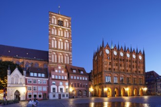 Night view, left back St. Nikolai Church first mentioned 1276, 102 metres high, front left, white,