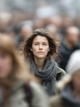 A woman stands in the middle of a crowd, symbolising mental health, stress in the big city,