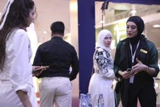 Saudi companies showcase products and investments inside the Saudi pavilion at the Damascus