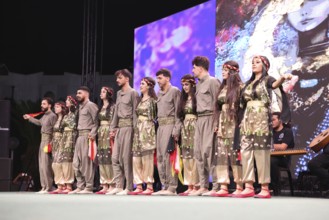 A Kurdish traditional dance troupe performs during the Damascus International Fair, the first