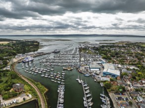 Wight Light car ferry to Isle of Wight on Lymington River and marina from drone, Lymington, New