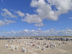 North Sea beach, car park, blue sky, white clouds, summer, sun, sand, beach chairs, on the edge of