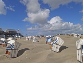 Sand drifts on the North Sea beach, blue sky, white clouds, summer, sun, sand, pile dwelling,