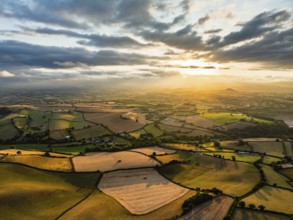 Sunset of Fields and Farms over Devon from a drone, Torquay, Torbay, Devon, England, United Kingdom