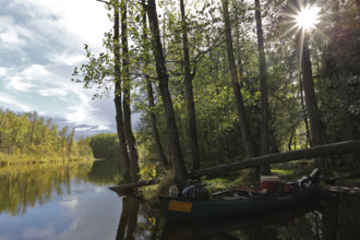 Canoe by nature photographers in Drosedower Bek, Müritz National Park, Mecklenburg-Western