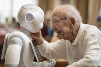 An elderly man in a nursing home smiles and communicates with a humanoid robot, carer robot, symbol