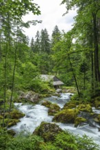 Golling watermill from above at the waterfall with the water pipe. Traditional mill in an alpine