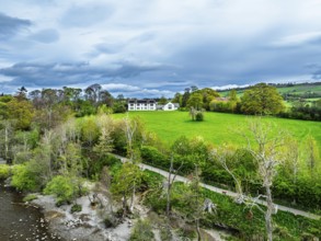 Farms and mountains over Ullswater Lake from drone, Pooley Bridge, Lake District National Park,
