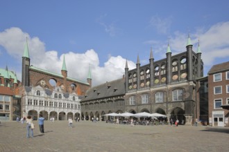 Renaissance and Gothic town hall and pedestrians, tourists, Brick Gothic, brick buildings, market,