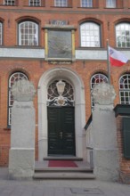Entrance to the Schiffergesellschaft restaurant with painting, brick building, Old Town, Lübeck,