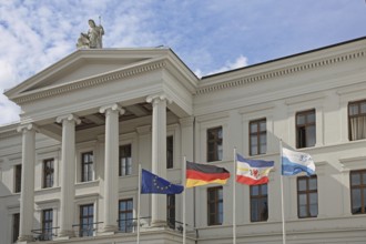 Portal with columns and EU flag, German national flag and Mecklenburg-Vorpommern state flag on the