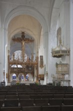 Interior view of the Gothic cathedral and pulpit with pulpit cover, rood screen with triumphal