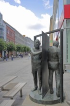 Sculpture revolving door by Waldemar Otto 1929, two, male figures, between, separated, opposite,