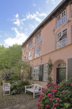 Idyllic Füchtingshof with flower decoration, hydrangea, benches, ornamental plants, potted plants,