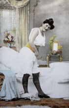 Female nude from around 1899, erotic postcard, playgirl, woman in historical underwear dressing in