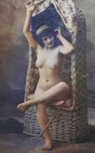 Female nude from around 1899, erotic postcard, Playgirl, A woman poses naked on an antique wicker