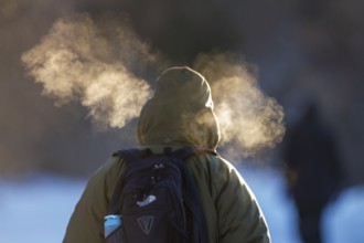 Person walking in very cold weather, Visual effect of the steam seen when exhaling in cold weather.