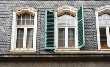 Green shutters on a slate-roofed house in the historic centre of Wuppertal, Wuppertal, Germany