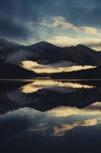 Sunrise with reflections in the Plansee in Tyrol in the Alps in Austria