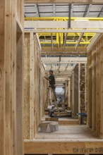 Romulus, Michigan - Workers build apartments in Ginosko Modular 's factory using modular