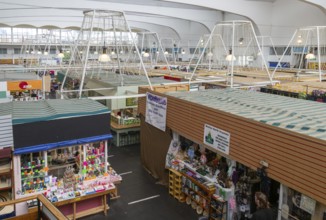 Raised view over roofs of market stalls in Market Building or Pannier Market, city of Plymouth,