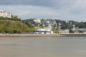 View to Princess Theatre and Ferris Wheel, Torre Abbey Sands sandy beach, Torquay, Devon, England,