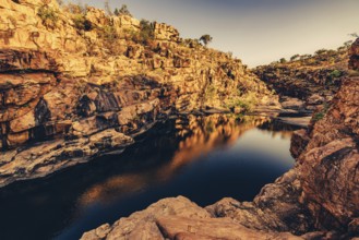 Bell Gorge waterfall, a body of water in north-west Australia in the Kimberley. Sunrise in the
