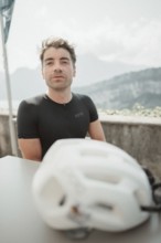 Young man riding a racing bike on Lake Garda. Sunny weather and dolce vita