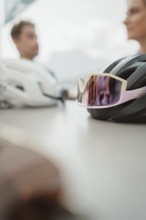 Young man taking a coffee break while riding his racing bike on Lake Garda. Sunny weather and dolce