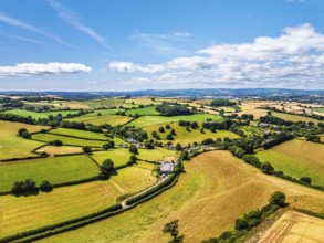 DefaultFarms and Fields over Torquay from a drone, Devon, England, United Kingdom