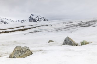 Melting glacier, stones, water, mountain peak, Cooper Camp, Spitsbergen, Svalbard