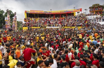 People from the Pnar community march in a circle as they celebrate an event organized to mark the