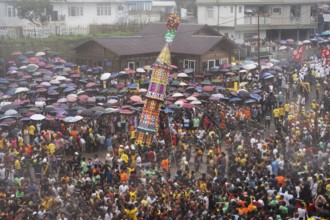 People from the Pnar community march in a circle around a Rot as they celebrate an event organised
