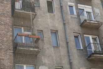 A house with balconies is protected from pigeons with a net, Bratislava, Slovakia