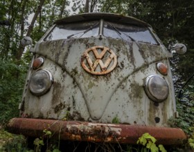 Old, weathered VW bus parked in a wooded area, Hesse, Germany