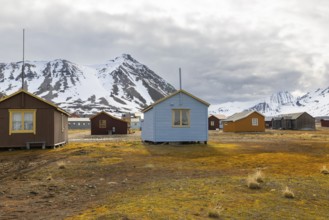 Wooden house against a mountain backdrop, Ny-Alesund, Spitsbergen, Svalbard