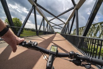 Ride over the De Massover cycle path bridge, over the Meuse south of Nijmegen, near Cuijk, part of