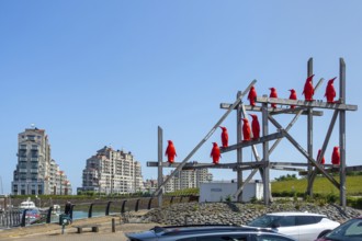 Rode Pinguins, Red Penguins, artwork by Belgian artist William Sweetlove in the harbour of Breskens