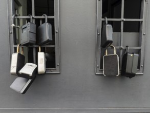 Key boxes on a grille of a basement window for flat flats in the city centre of Bratislava,