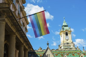 Rainbow flag on the Primatial Palace, in the background is the Old Town Hall of Bratislava,