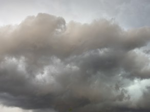 Dark discoloured storm clouds Cloud roll above grey clouds Rain clouds herald thunderstorms,