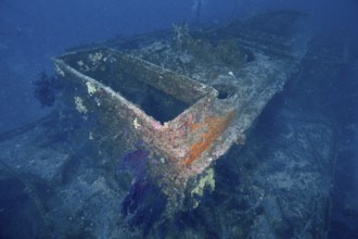 Rusty shipwreck in deep blue water. Dive site wreck Le Grecq, Giens peninsula, Mediterranean Sea,