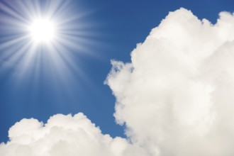 Symbolic image, global warming, heat, a bright sunshine next to fluffy white clouds in a clear blue