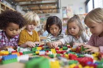 Children developing creativity while playing painting and drawing games at the table at daycare