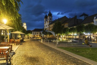 Night shot of the Peace Square in the old town centre of Trencín, in the background the Piarist