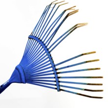 A bright blue rake with elongated tines is showcased against a neutral backdrop, emphasizing its