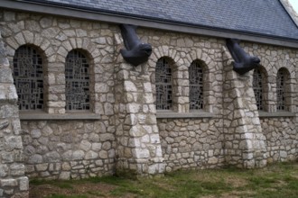 Side view, decorations, fish heads as gargoyles, church Chapelle Notre Dame de la Garde, Étretat,