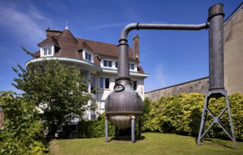 Distillation plant, distillery, boiler, behind it art gallery Domaine Création, Fécamp, Normandy,