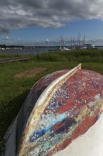 Boat with keel up, weathered paint in many colours, Jachthafen Baltic resort Rerik,